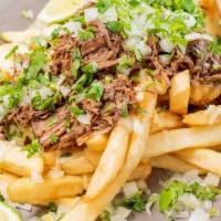 Birria Fries · Signature birria piled on top of French fries with Oaxaca cheese blend, onions and cilantro.