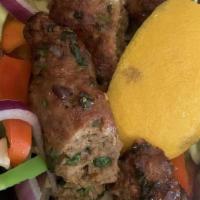 Seekh Kebab · Freshly ground lamb mixed with spices, red onion and cilantro. Dairy free.