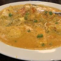 Navratan Korma · Mixed vegetables and fruit cooked in a mild cream sauce, thickened with ground cashews nuts..