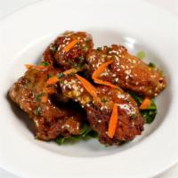 Buffalo Wings · With a spicy szechwan sauce.