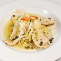 Chicken Picatta Over Pasta · Tender chicken with lemon caper sauce over angel hair pasta topped with parmesan.