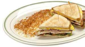 The Sequoia Breakfast Club · A towering club sandwich with eggs, ham, bacon, lettuce, tomatoes, cheddar cheese and served...