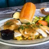 Roast Turkey Dinner · A smaller portion of our hand carved turkey dinner, served with stuffing.