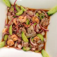 Aguachile Campechano · shrimp , octopus  scallops  red onions and cucumber.