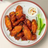 Classic Wings · Breaded and deep-fried chicken wings fried until golden brown.