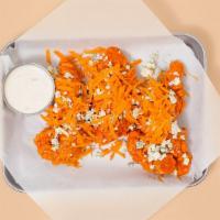 Buffalo Tenders · Three crispy fried chicken tenders drenched in buffalo sauce with funky blue cheese crumbles...