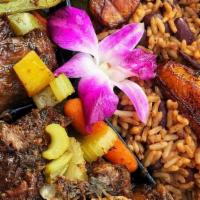 Oxtails With Creole Rice · Oxtails braised with fresh herbs, tomato, baby carrots, bell peppers and onions, served with...