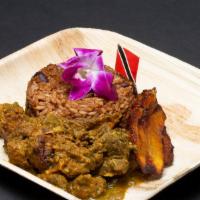 Curry Goat with Pelau · Goat cooked with Chef Ann's signature curry blend and fresh herb seasoning, served with pela...