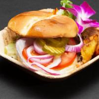 Angus Beef Burger · 1/3lb Angus Beef Burger served on a brioche bun with a side of 2 deep fried plantains and yo...