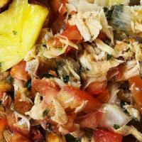 Saltfish Side · GF. 
Flaked Saltfish  sautéed with fresh herbs, tomatoes, bell peppers, and onions