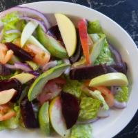 House Salad · Romaine lettuce, red onions, tomatoes, with vinaigrette dressing.