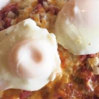 Corned Beef and Hash · Fresh lean corned beef and onions chopped into potatoes, topped with 2 eggs any style. Serve...