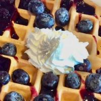 GF - Blueberry Waffle · Topped with blueberries in a blueberry glaze with fresh whipped cream.