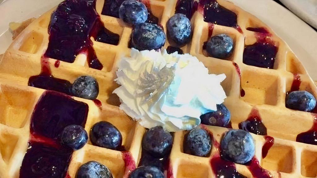 GF - Blueberry Waffle · Topped with blueberries in a blueberry glaze with fresh whipped cream.