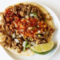 Regular Taco · Choice of meat, onion, cilantro, red sauce.