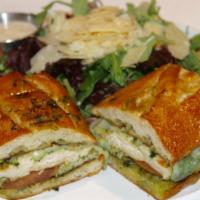 Panini Pollo Pesto · Toasted French bread with grilled chicken, pesto sauce, mozzarella cheese served with mixed ...
