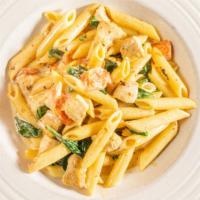 Penne Adriatico · Tube pasta with chicken, spinach, fresh tomato, in cream sauce.
