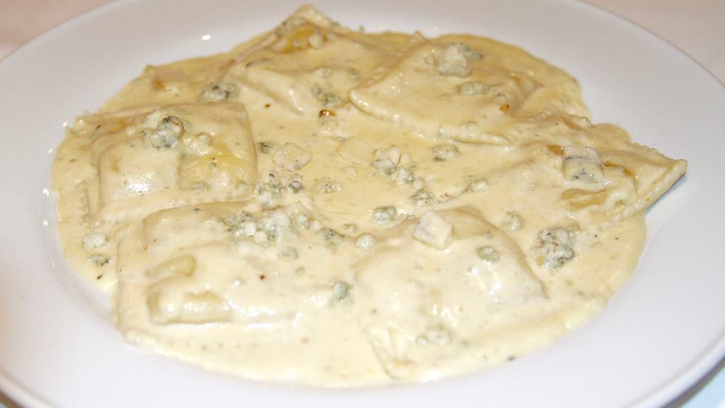 Ravioli Ricotta · Pasta stuffed with ricotta cheese, served in gorgonzola cream sauce.