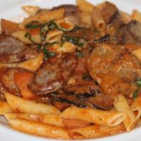 Penne Alla Luguri · Tube pasta with Italian sausage, grilled eggplant, in marinara sauce.