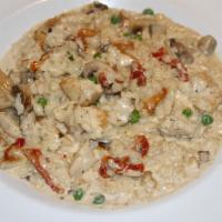 Risotto Al Pollo · Abrio rice with chicken, mushroom, green peas, sun-dried tomato, cream sauce