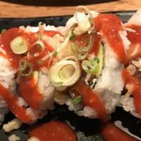 11. San Francisco Roll · Spicy. Tuna, salmon, yellow tail, avocado, topped with crunch and special spicy sauce.