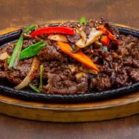 Bulgogi  w/bowl  of rice & side dishes · Spicy. Thinly sliced rib-eye. Marinated and grilled with Veges.  w/bowl  of rice & side dishes