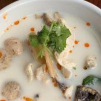 Tom Kha Gai · Sliced chicken in hot and sour coconut soup with galangal, lemongrass, mushrooms and onions.