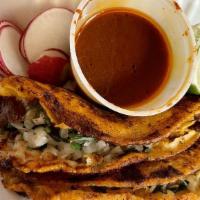 Quesabirra · Melted cheese, Birria, and dipping sauce