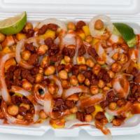 Tostilocos · Tostitos torilla chips, topped with freshly cut cucumbers, jicama, mango, Valentina hot sauc...