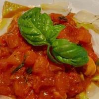 Ravioli alla Lucana  · Organic spinach ravioli filled with Italian sausage, ricotta, Grana Padano & fennel; topped ...