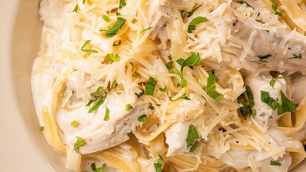 Fettuccine Alfredo With Chicken · Herb-Roasted Chicken & Asiago Cream Sauce