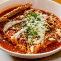 Lasagna · Delicate layers of fresh pasta with bolognese sauce, spinach, mushrooms, provolone, and 
Par...