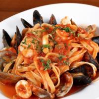 Frutti di Mare · Manila clams, PEI mussels, shrimp, and calamari in a spicy lobster broth, and tomato sauce w...
