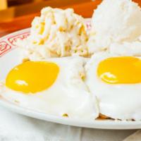 33. Loco Moco · Savory homemade hamburger patties over rice covered with brown gravy and topped with eggs. S...