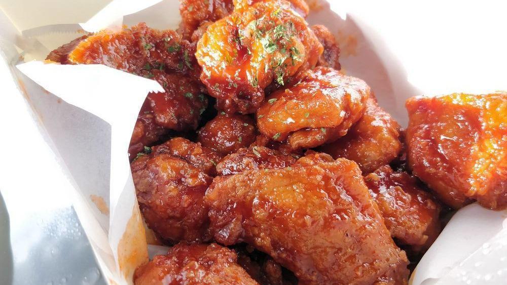 날 개 튀 김 / Fried Chicken Wings · Cooked wings of a chicken coated in sauce or seasoning.