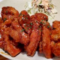 매 운 날 개 튀 김 / Spicy Fried Chicken Wings · Cooked wings of a chicken coated in sauce or seasoning.