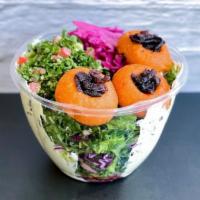 Lentil Mental Salad · Fresh herb labne, red lentil balls, crispy onion, tabouli, red cabbage pickles, pomegranate ...