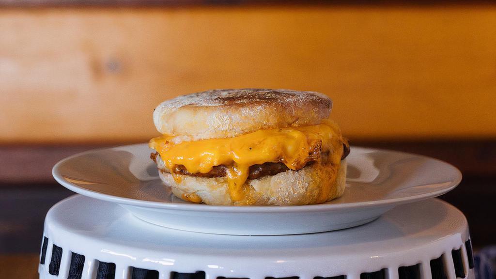 Sausage Breakfast Sandwich · Pork Sausage Patty, Egg, Cheddar Cheese & House-made Chipotle Aioli on an English Muffin