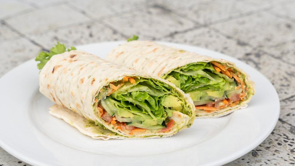 Vegan Hummus Wrap · Lavash with Hummus, House-made Vegan Pesto, Avocado, Cucumber, Tomato, Shredded Carrots & Green Leaf Lettuce.