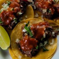 Tacos De Cabeza De Res · tortilla cebolla cilantro salsa carne de cabeza de res