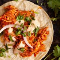 Tacos De Tinga De Pollo · pollo desebrado con Chipotle sauce onions and cilantro