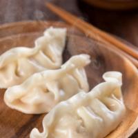 Boiled Dumpling with Hot Oil · Classic boiled dumplings topped with hot oil.