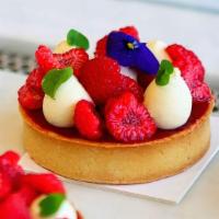 Raspberry & Wild Vanilla Tart · Sugar dough tart shell filled with a baked almond cream that brings a smooth texture, a dipl...