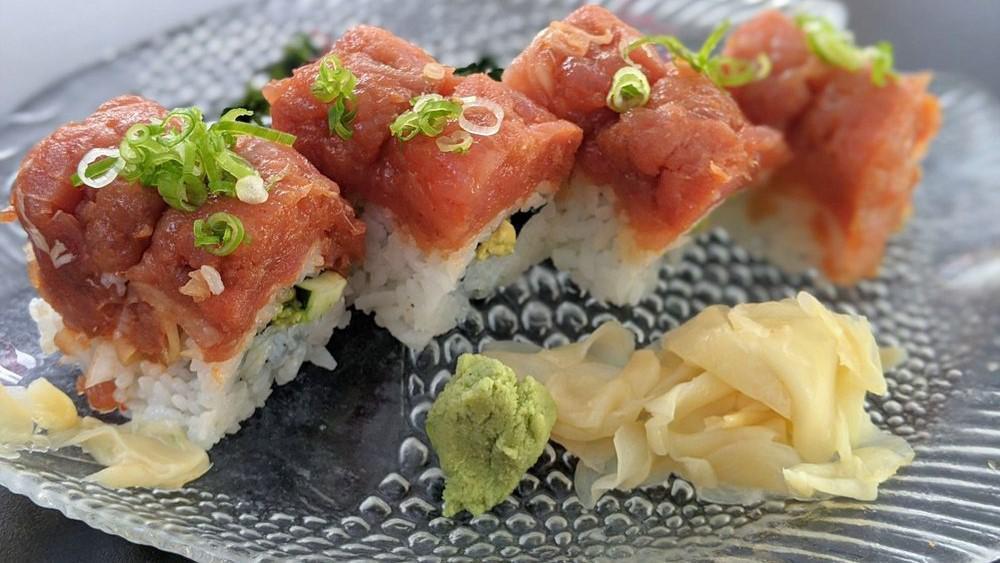 Spicy Tuna · Spicy tuna with cucumber and avocado topped with green onion.