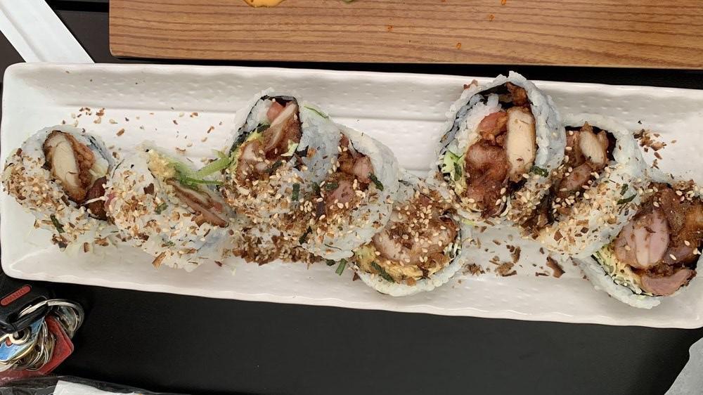 Papasan Roll · Fried  chicken cabbage, cucumber, avocado, tomato with Japanese mayonnaise and sprinkle of furikake.