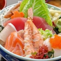 Chirashi · Assorted fresh fish and vegetables over sushi rice with salad