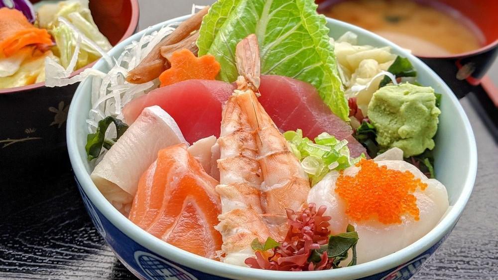 Chirashi · Assorted fresh fish and vegetables over sushi rice with salad