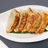 Gyoza (5 pcs) · Pan-fried crispy dumplings, filled with pork and chicken. Served with dashi-based sauce and ...