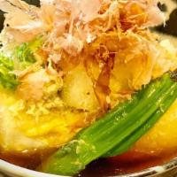 Agedashi Tofu · Lightly fried soft tofu served in a dashi-based sauce with soy sauce. Topped with bonito fla...