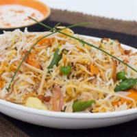 Nizami Tarkari Biryani · Long grain aged basmati rice cooked on dum with vegetables and aromatic spices, served with ...